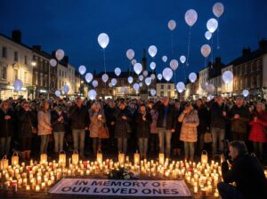 Community members releasing balloons during a vigil for fire victims in North Philadelphia
