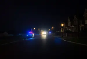 Scene of the double shooting in Crescentville with police lights and caution tape