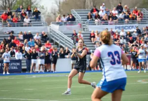Women playing lacrosse during a game at La Salle University