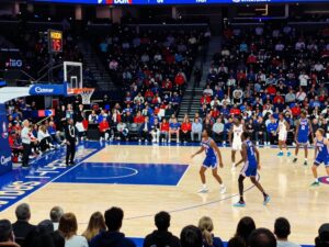 Crowd cheering at a Philadelphia college basketball game
