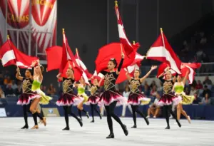 Dancers performing with flags at the winterguard competition in Batavia.
