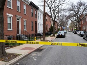 A quiet street in Mayfair neighborhood, Philadelphia, with police activity.
