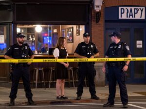 Police officers at the scene of a shooting outside a bar in North Philadelphia