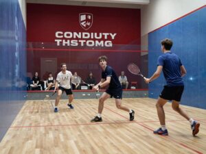 Penn squash teams cheering after a victory