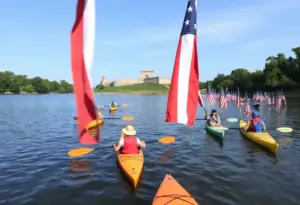 Participants kayaking on the Schuylkill River during the Philly Phlotilla with Fort Mifflin in the background.